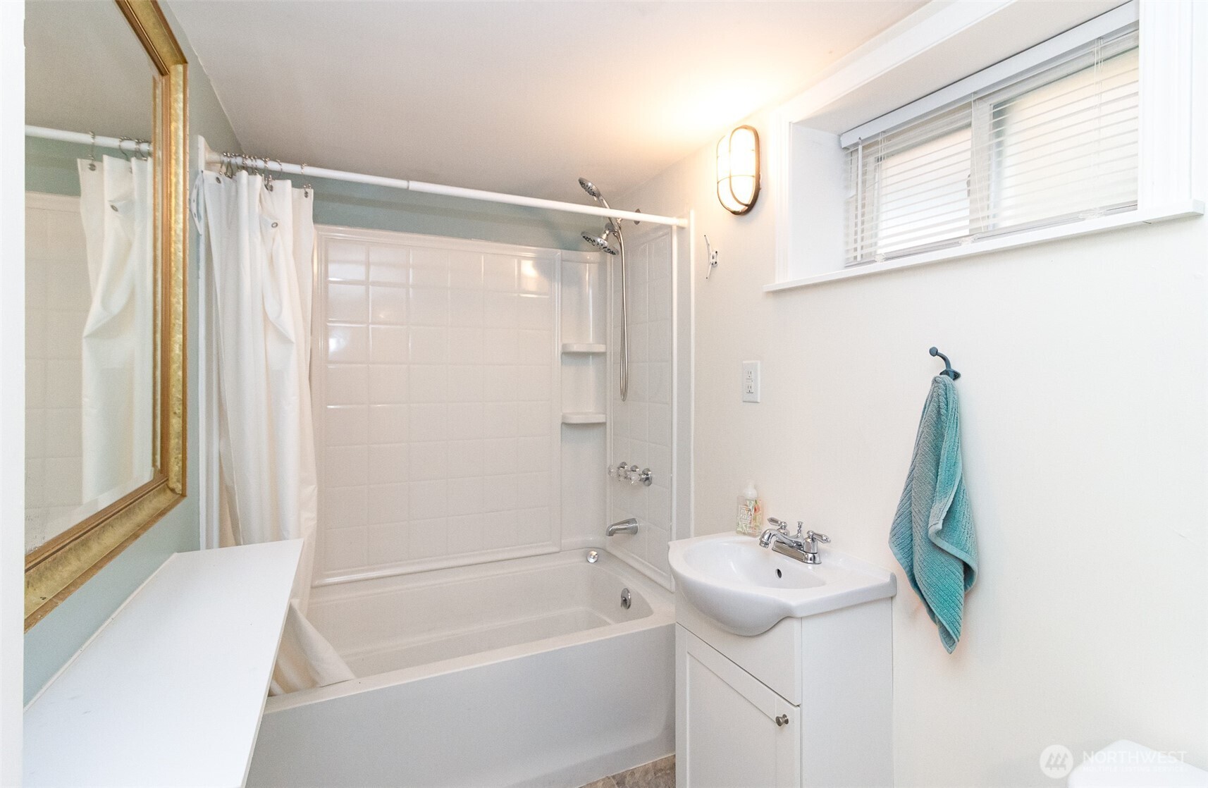 3503 Rockefeller Avenue Everett, WA 98201 - Photo 23 of 36 a bathroom with a tub sink and mirror