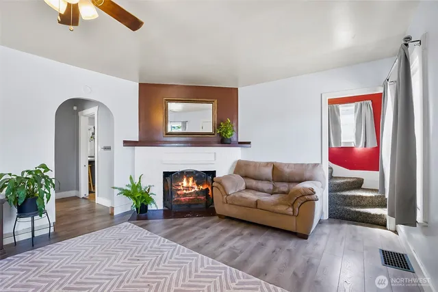 a dining room with furniture and wooden floor