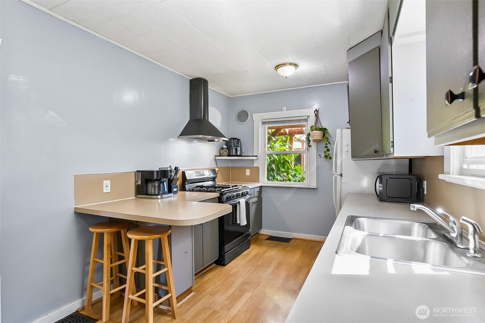 3503 Rockefeller Avenue Everett, WA 98201 - Photo 4 of 36 a kitchen with stainless steel appliances granite countertop a sink stove and refrigerator