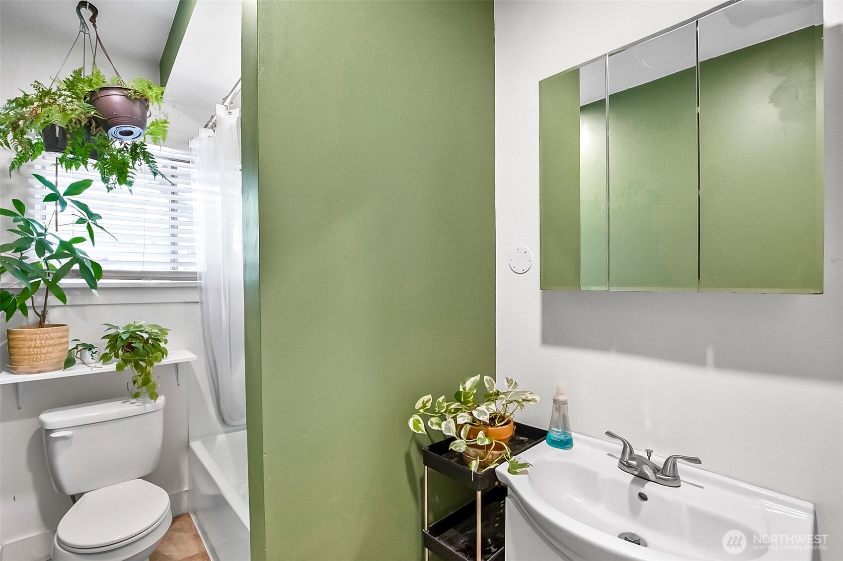3503 Rockefeller Avenue Everett, WA 98201 - Photo 6 of 36 a bathroom with a sink a toilet and a mirror