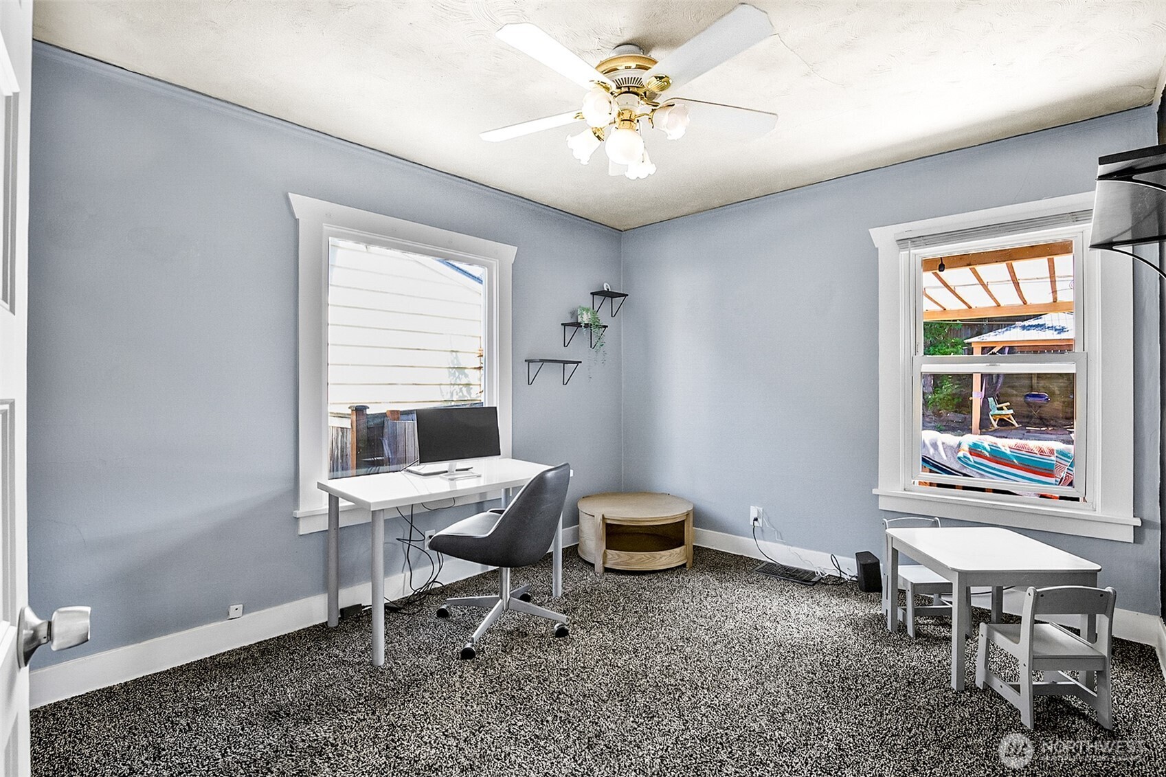 3503 Rockefeller Avenue Everett, WA 98201 - Photo 7 of 36 a view of a workspace with furniture and a window