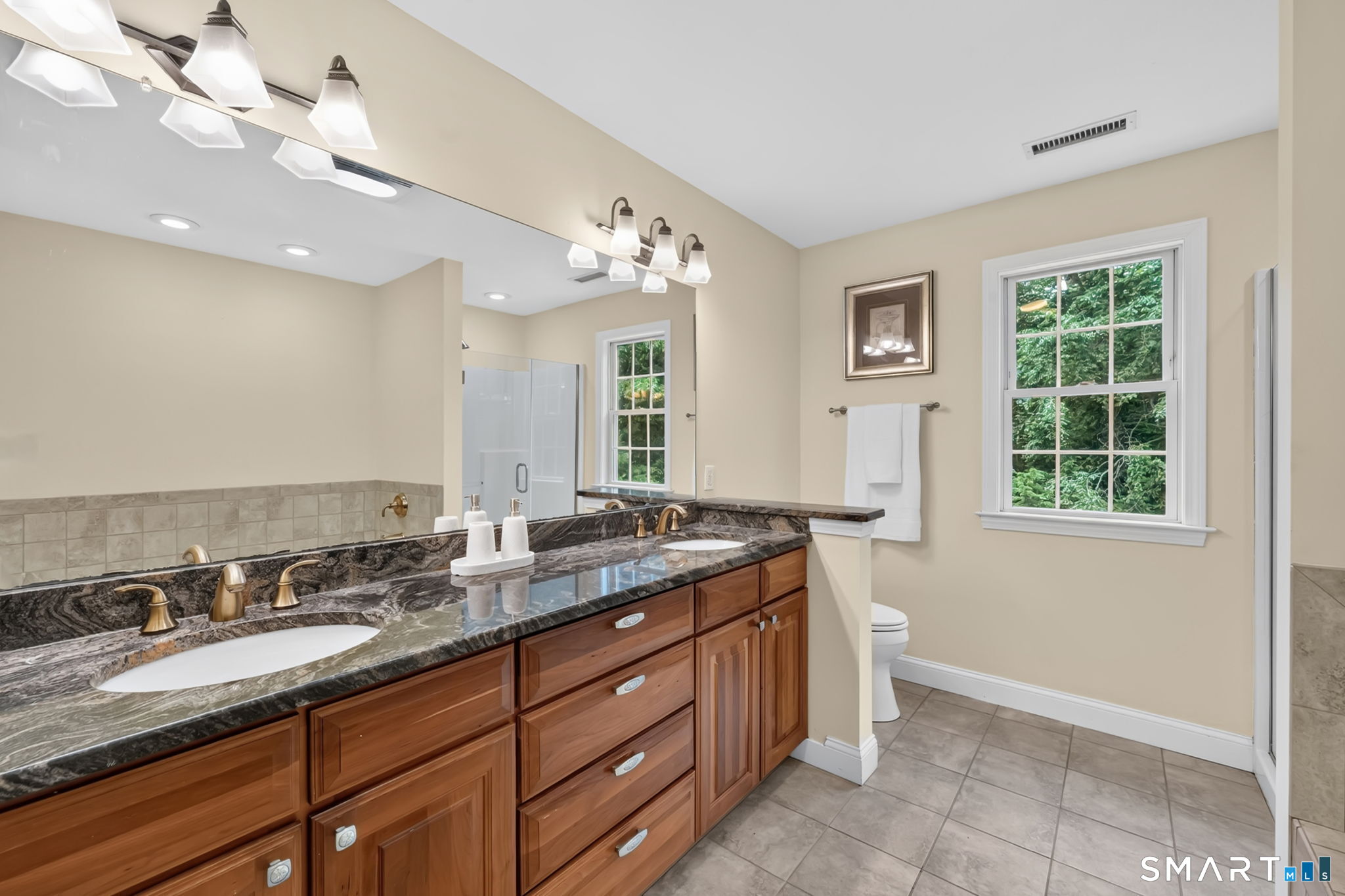 5 Edwards Way Bloomfield, CT 06002 - Photo 29 of 40 Full bathroom ensuite to the Primary Bedroom. Includes a jetted tub and a stall shower. Double sinks, custom cabinetry and granite counters.