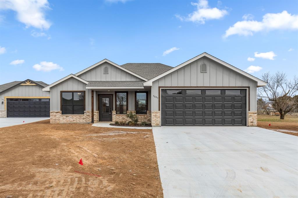 View of front of property featuring a garage