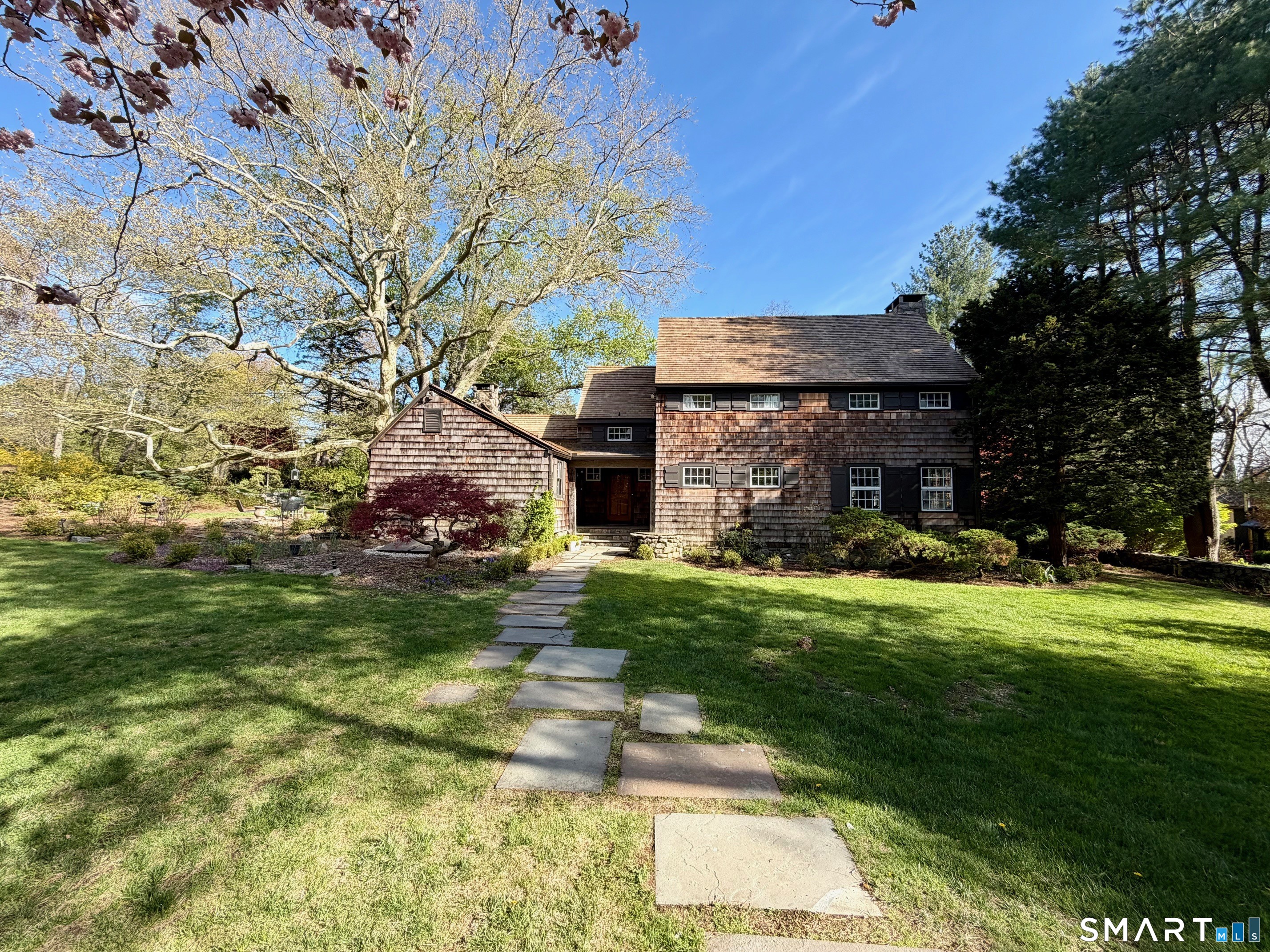 151 Skunk Lane Wilton, CT 06897 - Photo 1 of 39 a front view of house with yard