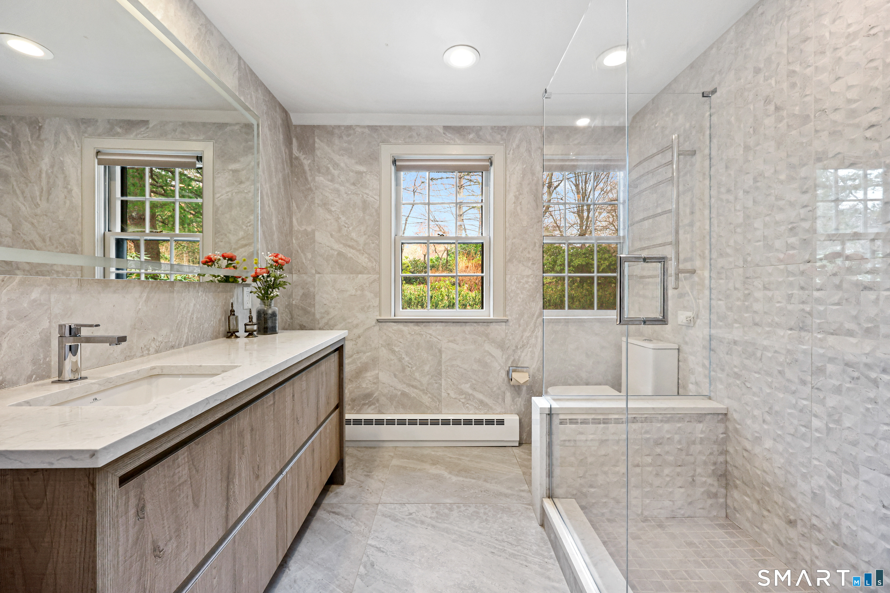 151 Skunk Lane Wilton, CT 06897 - Photo 16 of 39 a bathroom with a granite countertop sink and a bathtub