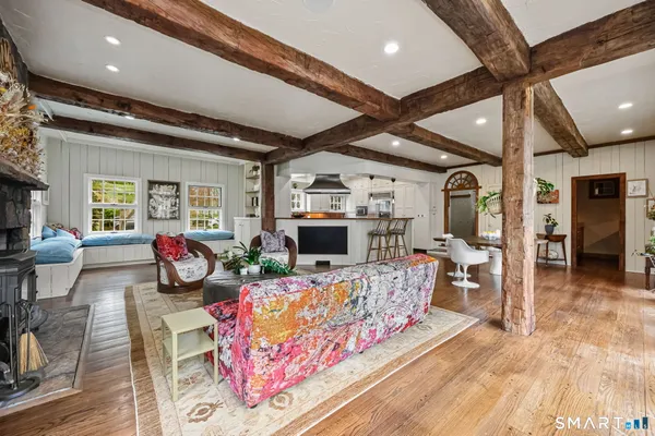 a bedroom with a bed and a chair