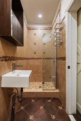 a bathroom with a sink and a mirror