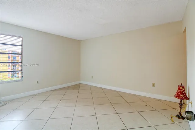 a view of an empty room and window