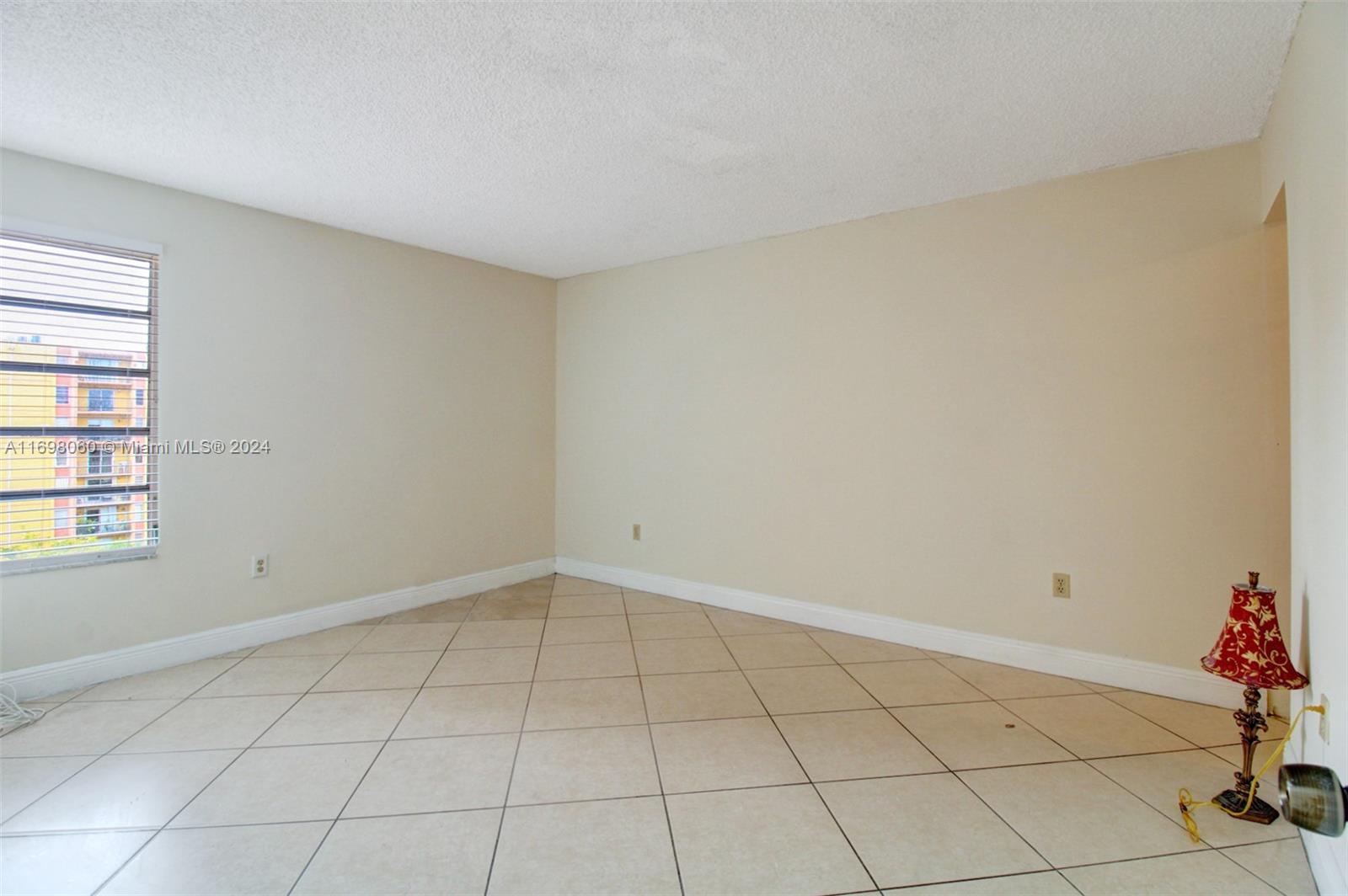 4717 Northwest 7th Street, Unit 60410 Miami, FL 33126 - Photo 13 of 20 a view of an empty room and window