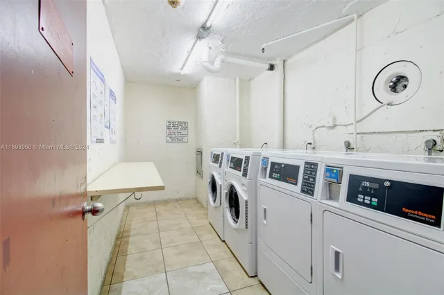 a bathroom with double vanity and a tub