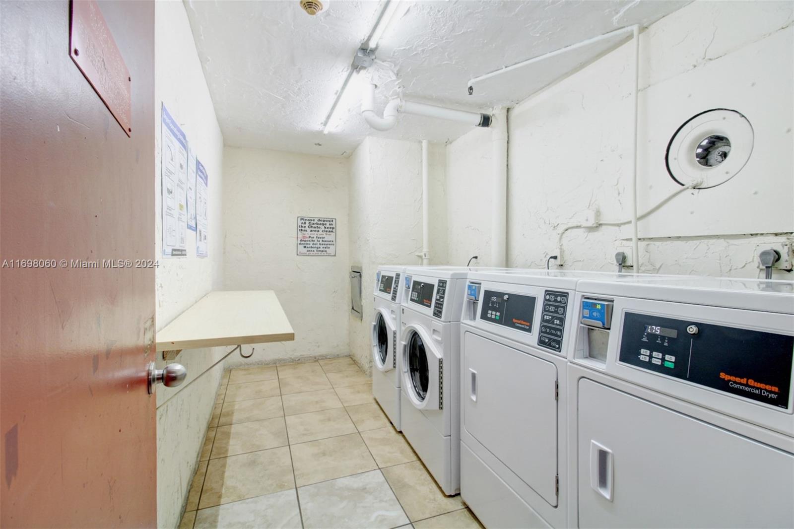 4717 Northwest 7th Street, Unit 60410 Miami, FL 33126 - Photo 19 of 20 a bathroom with double vanity and a tub