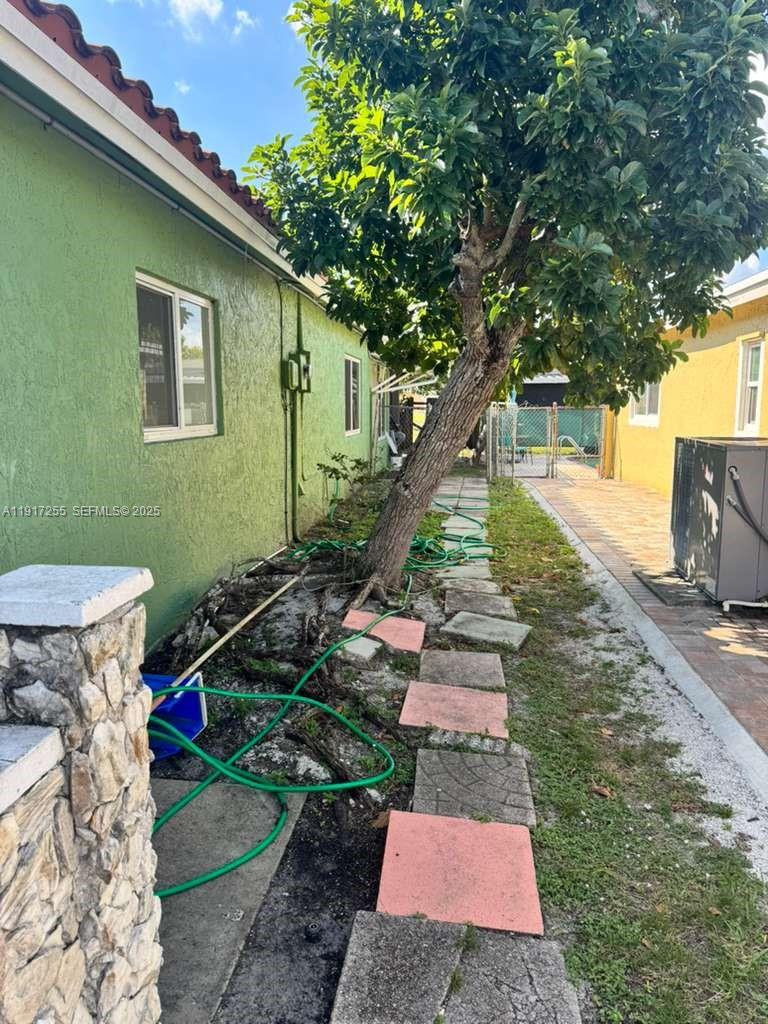 820 Southwest 49th Terrace Margate, FL 33068 - Photo 13 of 15 a view of a backyard with plants and a patio