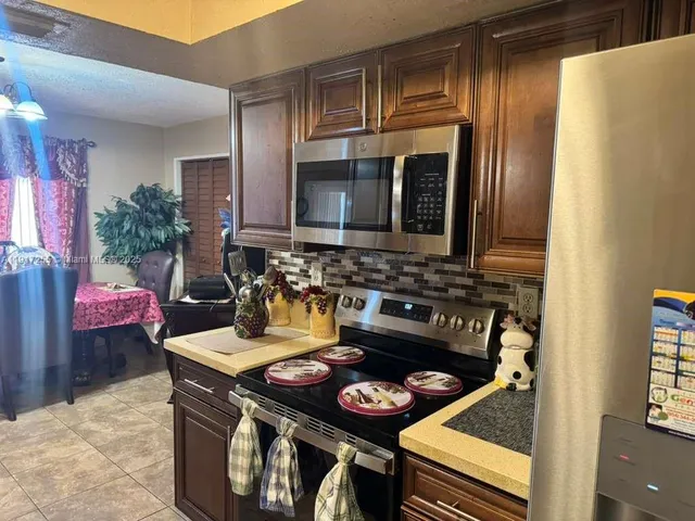 a kitchen with a stove and a sink