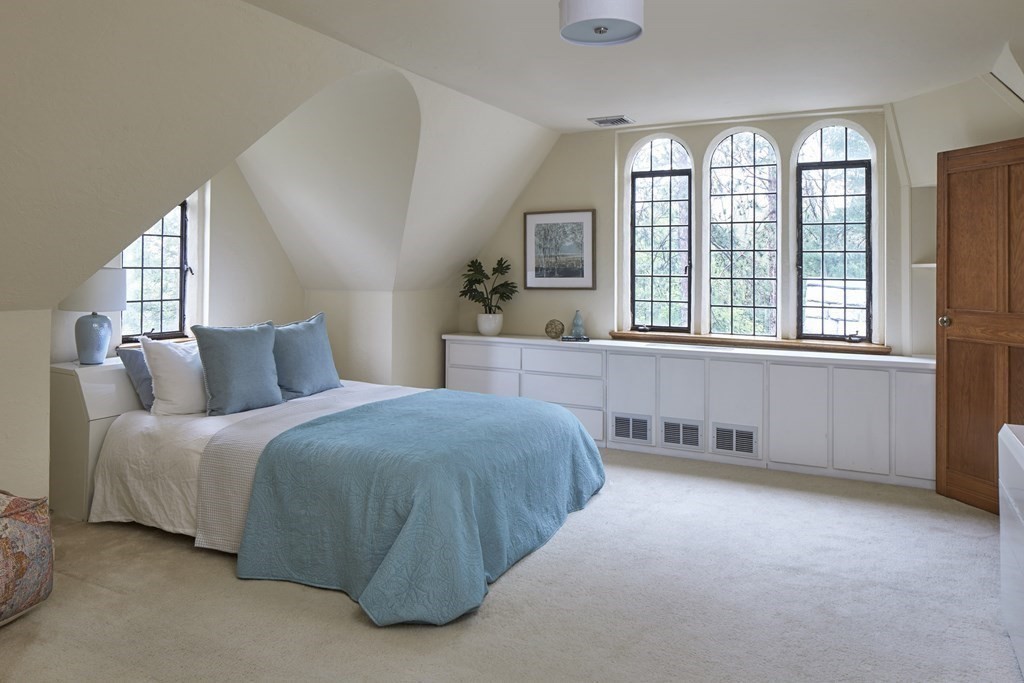 89 Fletcher Road Belmont, MA 02478 - Photo 19 of 32 a spacious bedroom with a bed and a large window