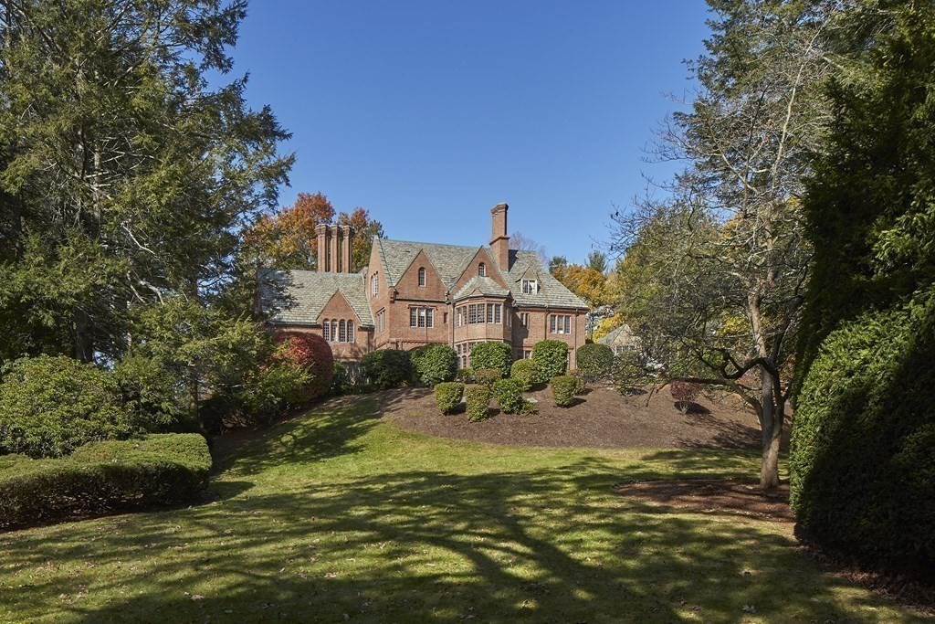 89 Fletcher Road Belmont, MA 02478 - Photo 25 of 32 a view of a big house with a big yard and large trees