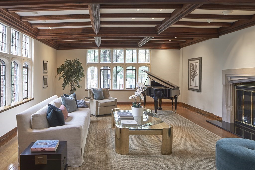 89 Fletcher Road Belmont, MA 02478 - Photo 3 of 32 a living room with furniture a wooden floor and a chandelier