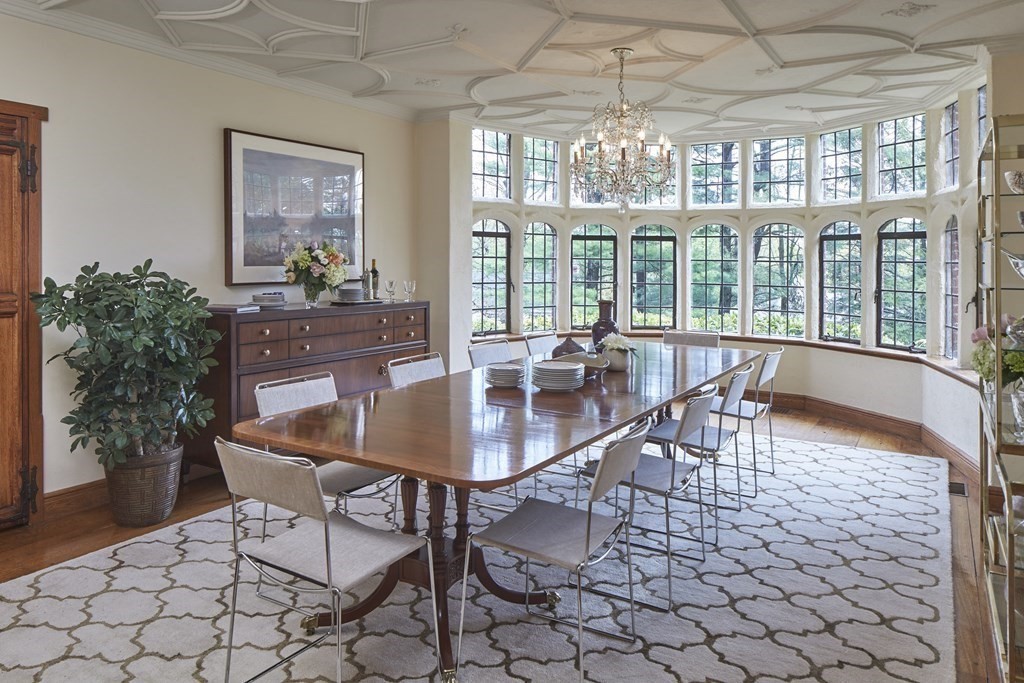 89 Fletcher Road Belmont, MA 02478 - Photo 4 of 32 a dining room with furniture a chandelier and wooden floor