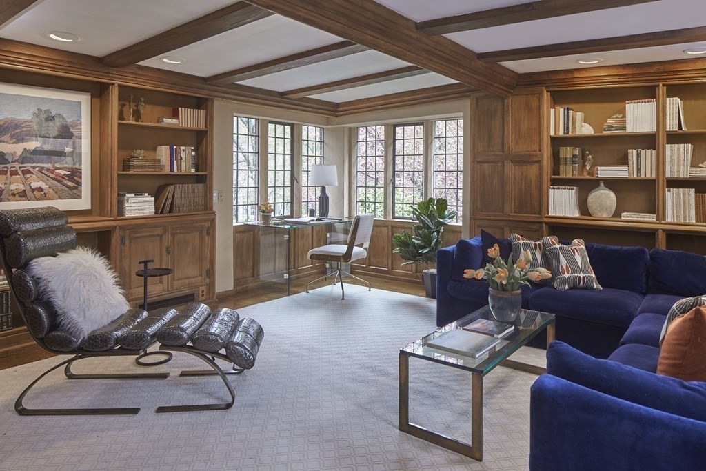 89 Fletcher Road Belmont, MA 02478 - Photo 8 of 32 a living room with furniture gym equipment and a large window