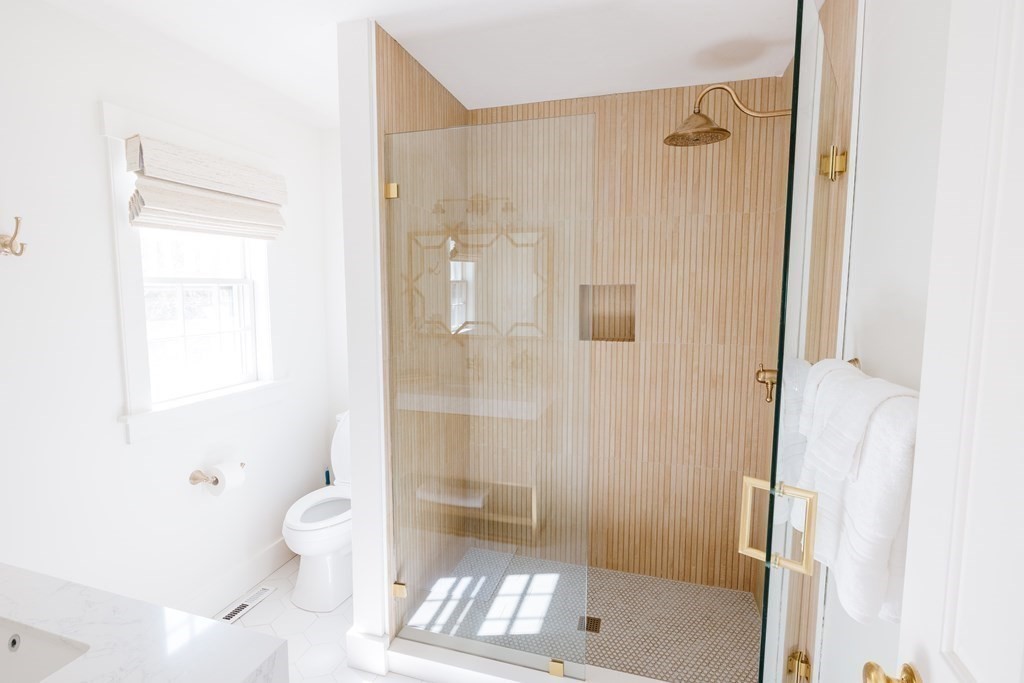 23 Kittiwake Lane Nantucket, MA 02554 - Photo 15 of 36 a bathroom with a shower and a toilet