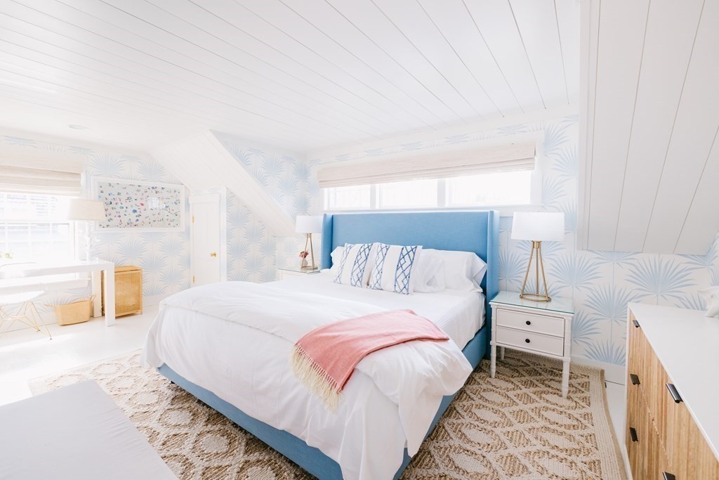 23 Kittiwake Lane Nantucket, MA 02554 - Photo 20 of 36 a bedroom with a bed and a lamp on the dresser