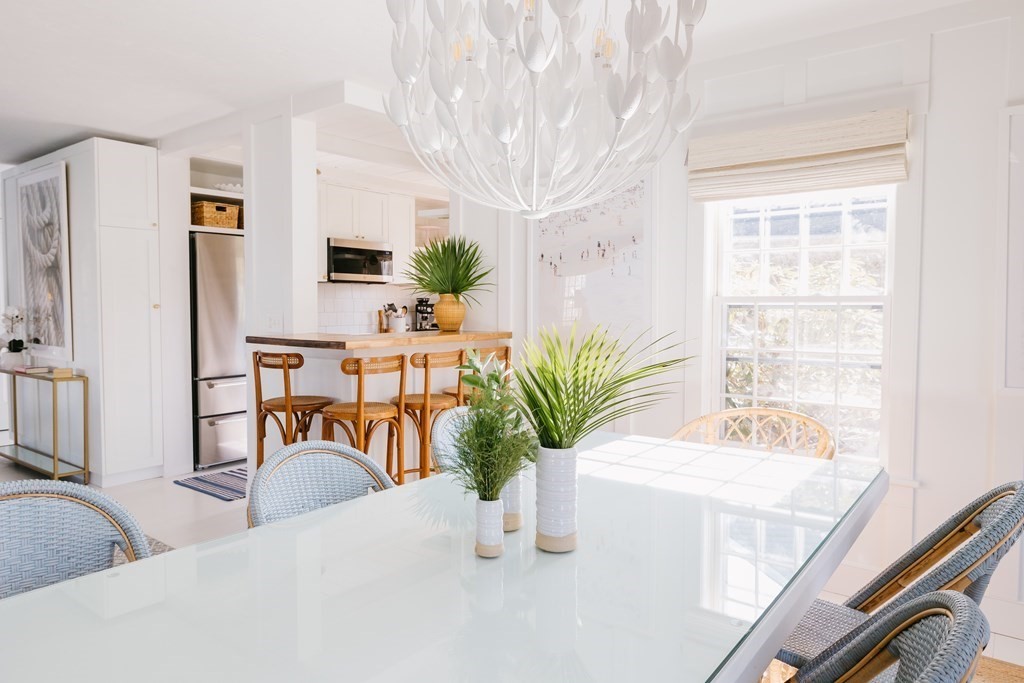 23 Kittiwake Lane Nantucket, MA 02554 - Photo 2 of 36 a dining room with furniture and a potted plant