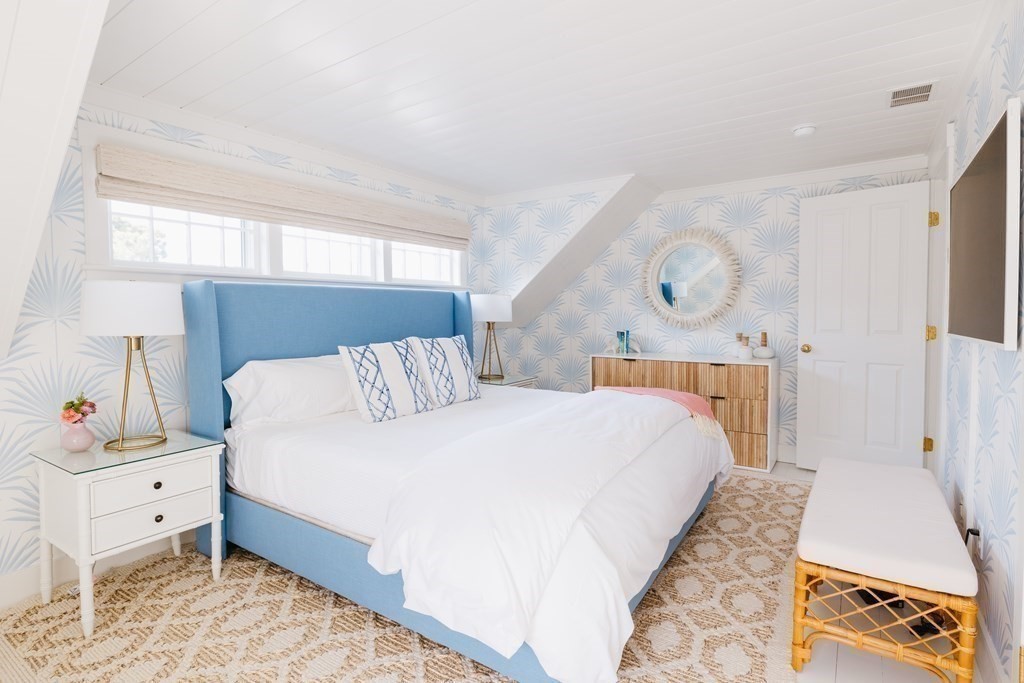 23 Kittiwake Lane Nantucket, MA 02554 - Photo 21 of 36 a bedroom with a bed and a night stand