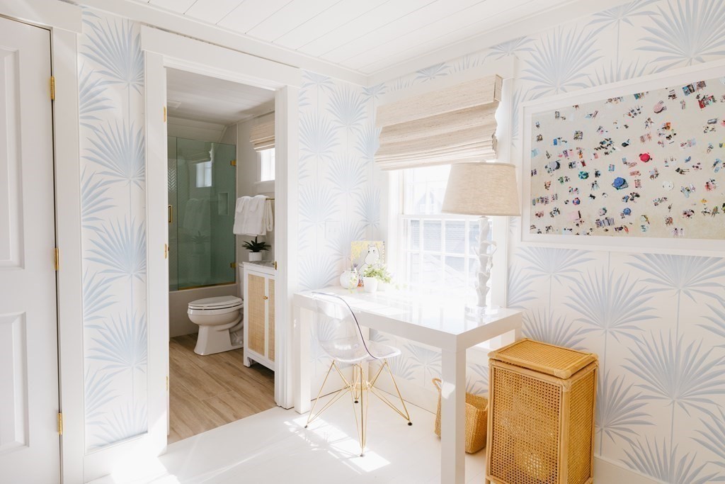 23 Kittiwake Lane Nantucket, MA 02554 - Photo 23 of 36 a living room with a couch and a table