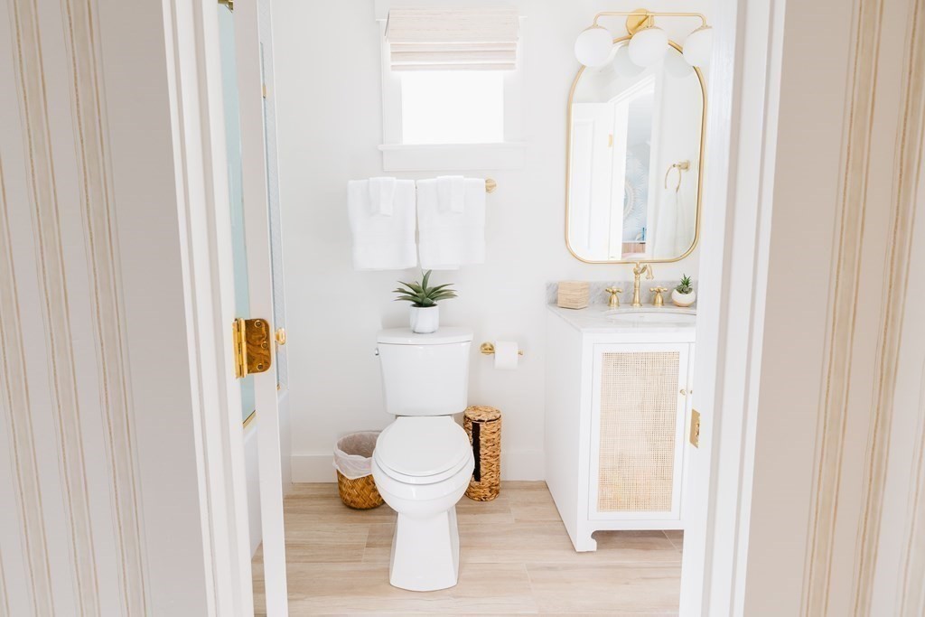 23 Kittiwake Lane Nantucket, MA 02554 - Photo 24 of 36 a white toilet sitting next to a bathroom sink