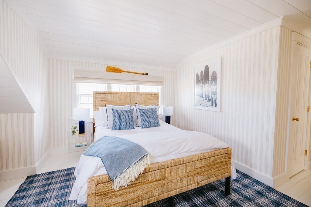 23 Kittiwake Lane Nantucket, MA 02554 - Photo 27 of 36 a bedroom with a bed and wooden floor