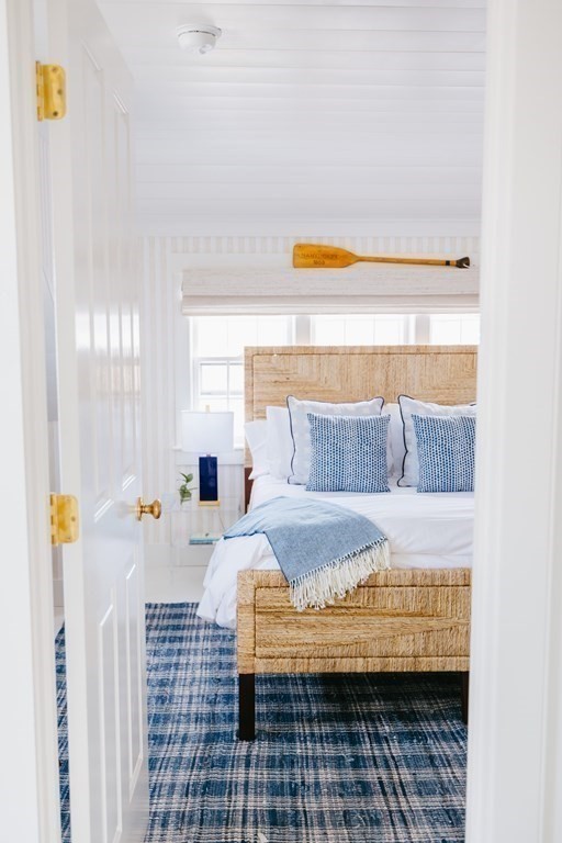 23 Kittiwake Lane Nantucket, MA 02554 - Photo 28 of 36 a bedroom with a bed and a window