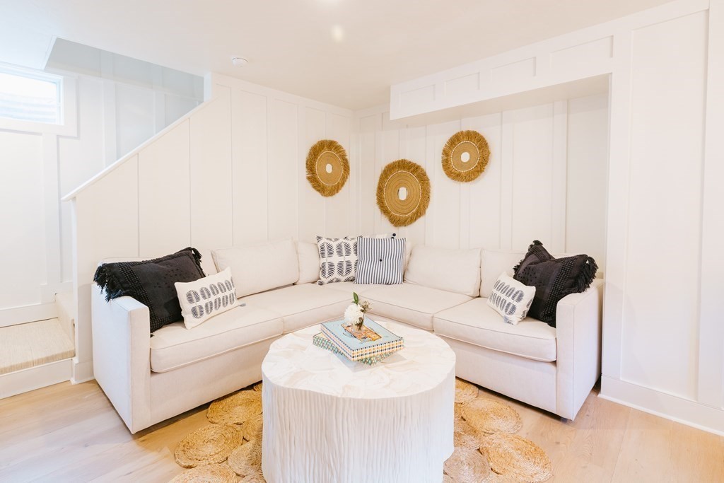 23 Kittiwake Lane Nantucket, MA 02554 - Photo 32 of 36 a living room with furniture and a wall painting