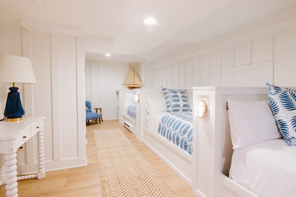 23 Kittiwake Lane Nantucket, MA 02554 - Photo 33 of 36 a spacious bedroom with a bed and a view of living room