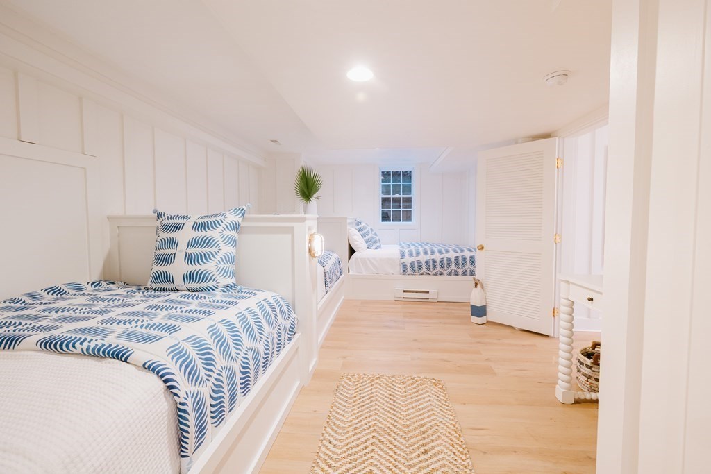 23 Kittiwake Lane Nantucket, MA 02554 - Photo 34 of 36 a bedroom with a bed and painting on the wall