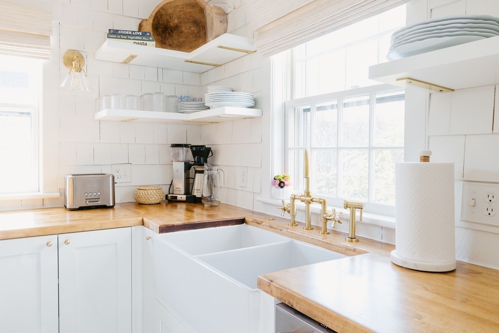 23 Kittiwake Lane Nantucket, MA 02554 - Photo 4 of 36 a kitchen with a sink appliances and a counter top space