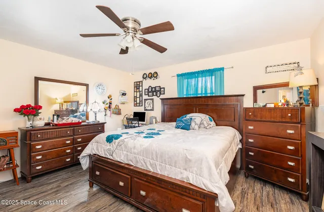 a bedroom with a bed and a dresser