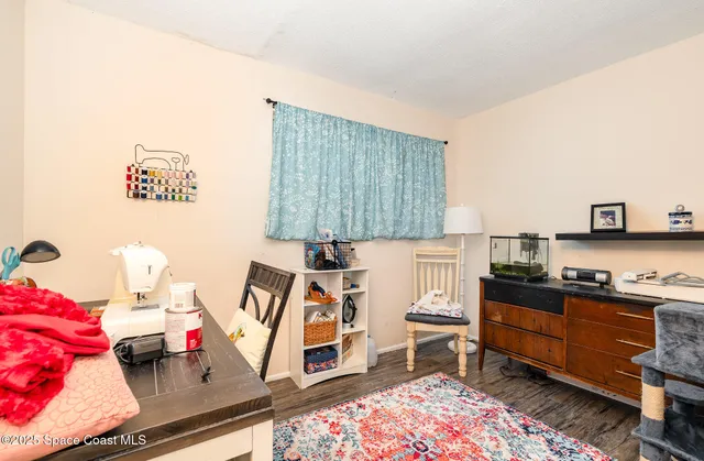 a room with furniture and musical instruments