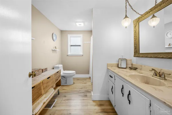 a bathroom with a bathtub a sink and a shower