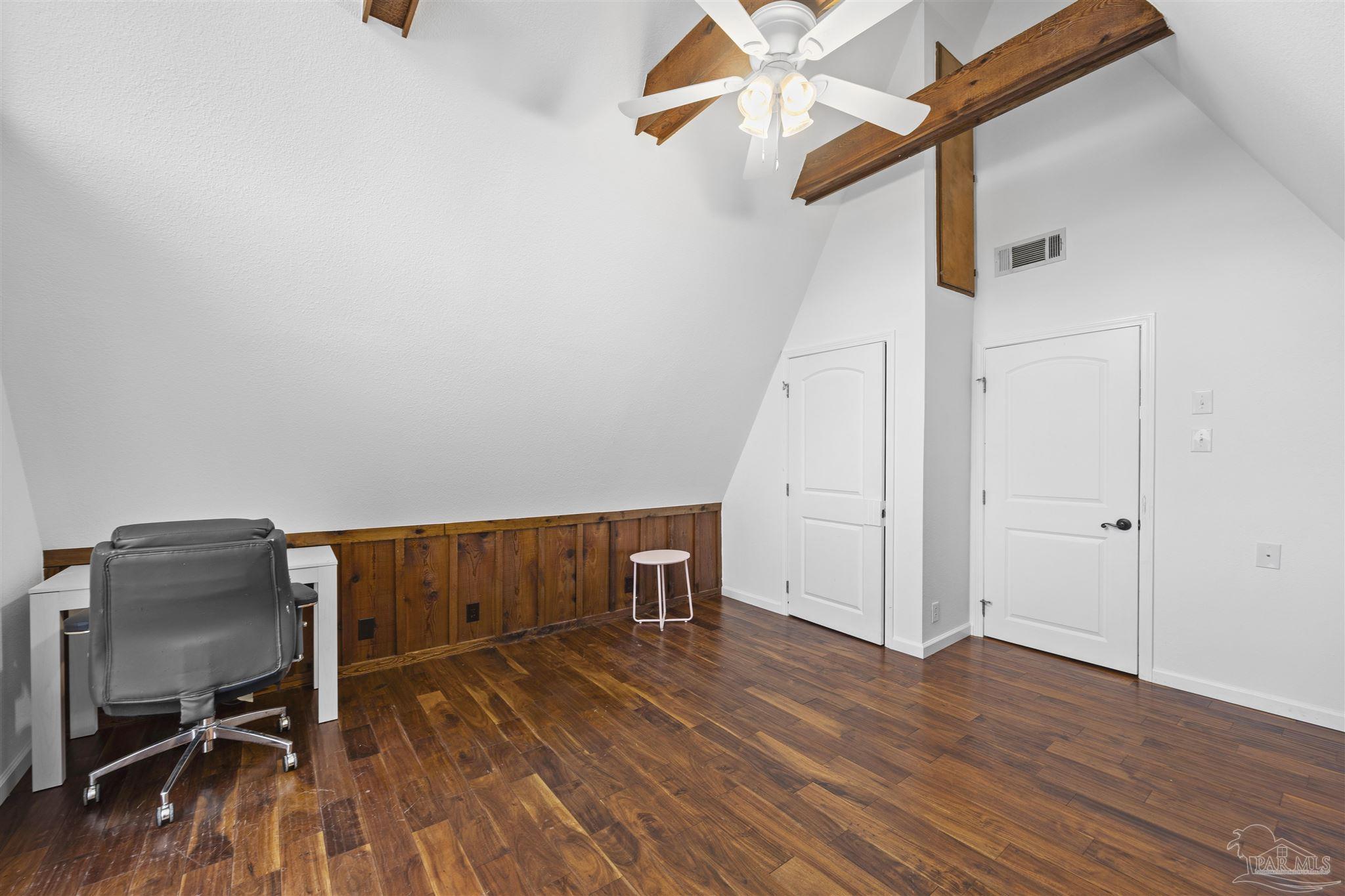 889 Dolphin Road Milton, FL 32583 - Photo 24 of 67 a view of a room with wooden floor and white walls