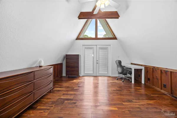 a view of workspace with wooden floor and furniture