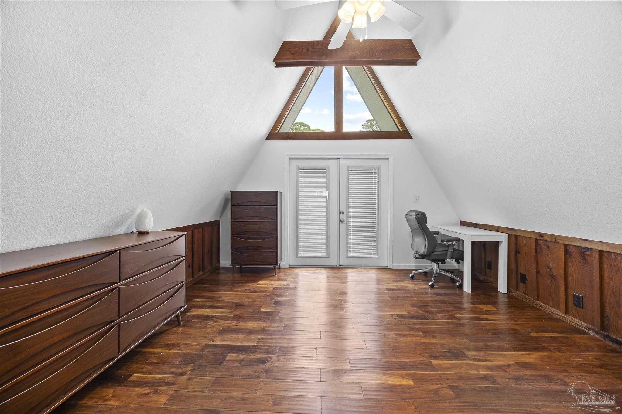 889 Dolphin Road Milton, FL 32583 - Photo 29 of 67 a view of a workspace with furniture and a window