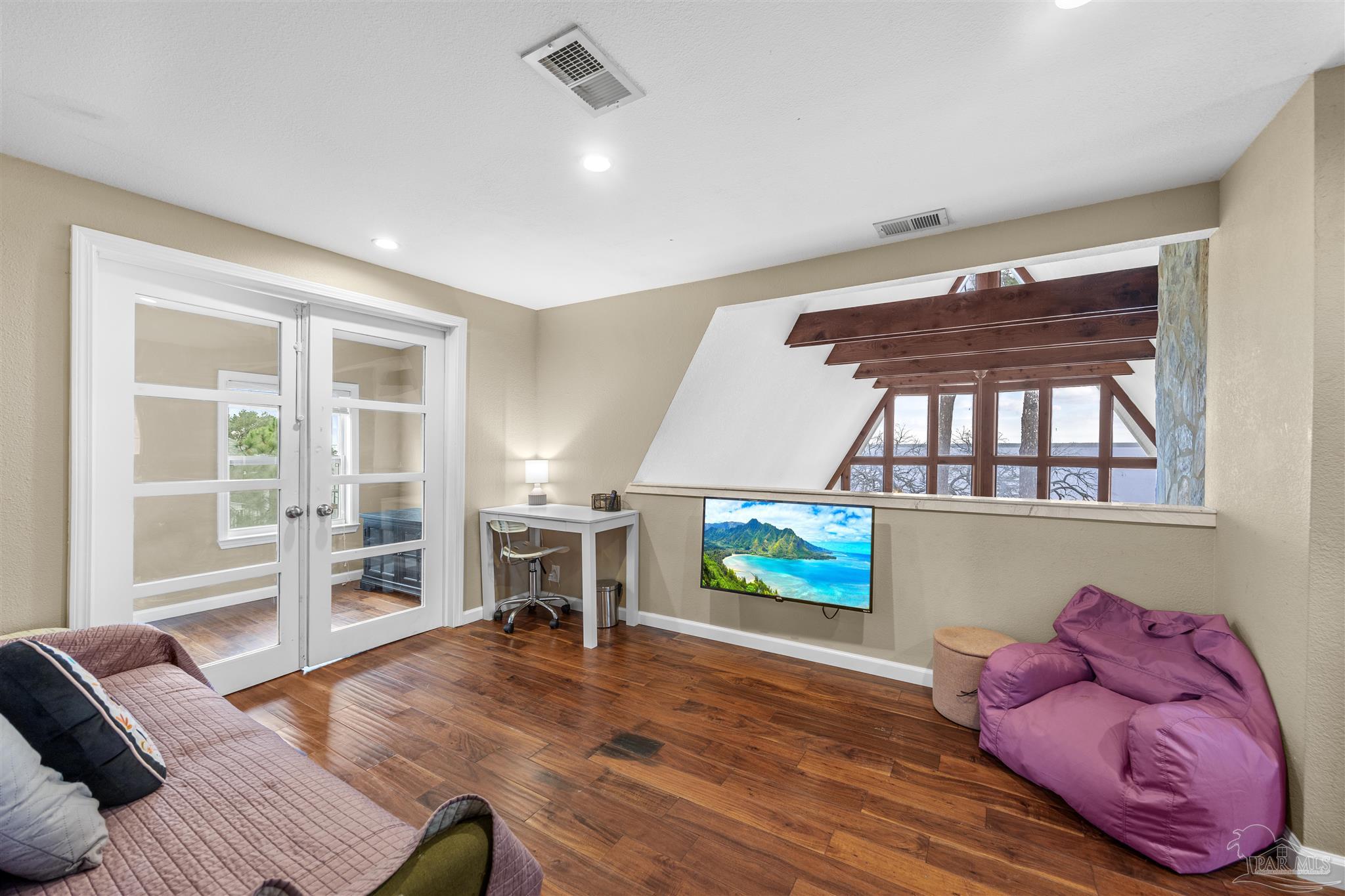 889 Dolphin Road Milton, FL 32583 - Photo 33 of 67 a living room with furniture and a wooden floor