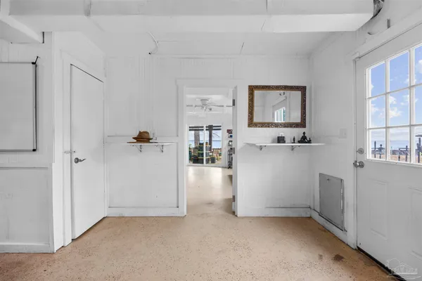 a view of kitchen with refrigerator cabinets and wooden floor