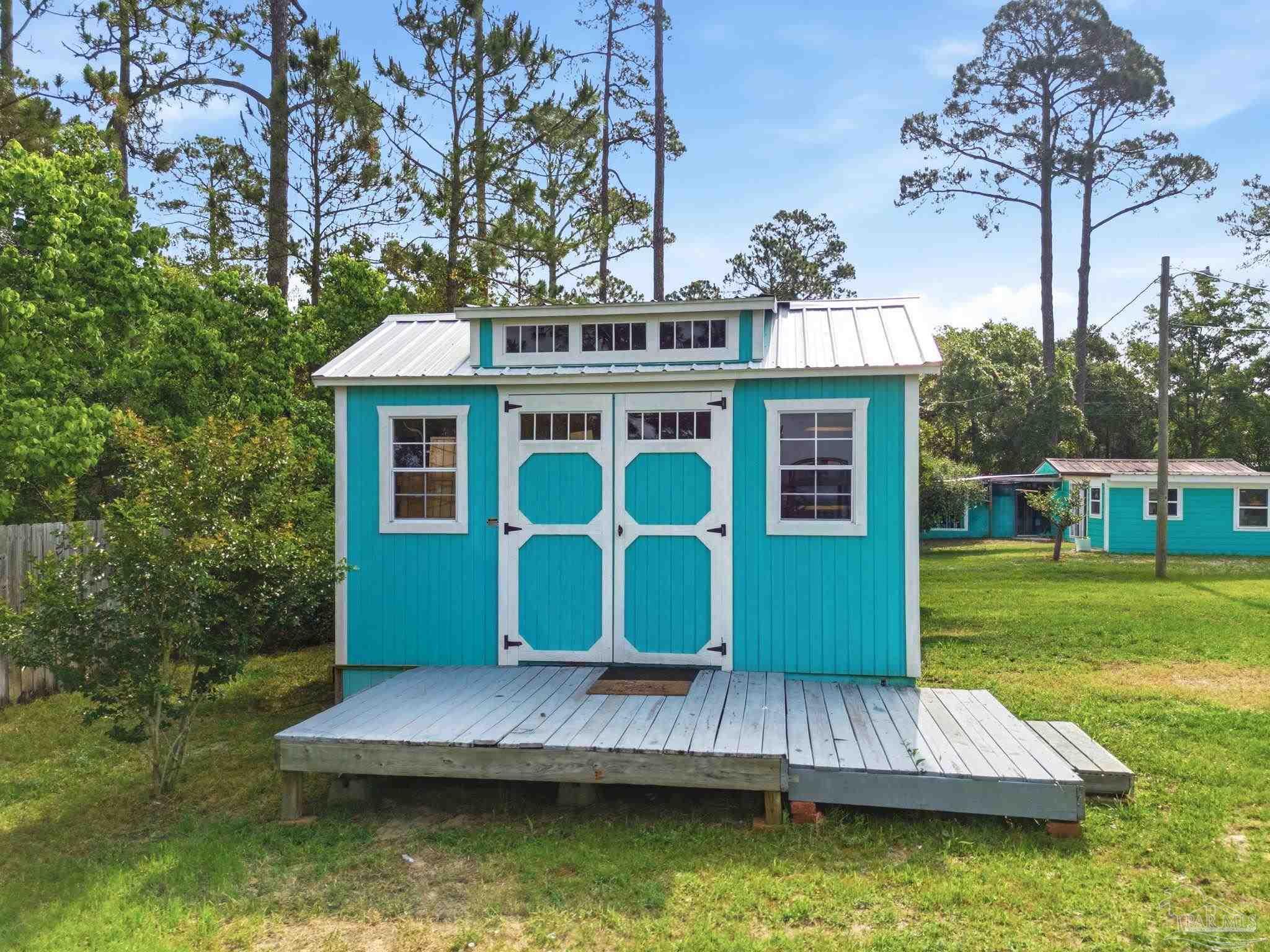 889 Dolphin Road Milton, FL 32583 - Photo 55 of 67 a view of a house with a yard from a tub