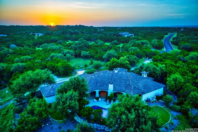 an aerial view of a house with garden