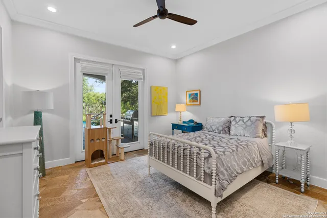 a living room with furniture a large window and a fireplace