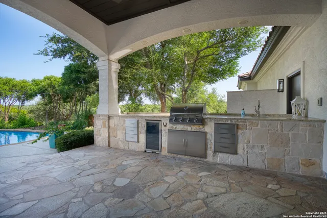 a view of a patio with swimming pool table and chairs