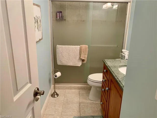 a bathroom with a toilet a sink and shower