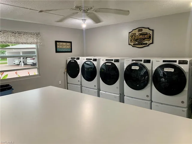 a bedroom with a bed and cabinets