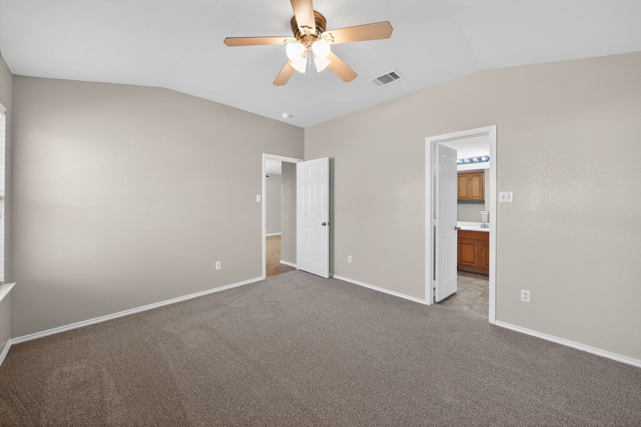 1007 Gentry Drive Leander, TX 78641 - Photo 22 of 35 an empty room with closet and a chandelier fan