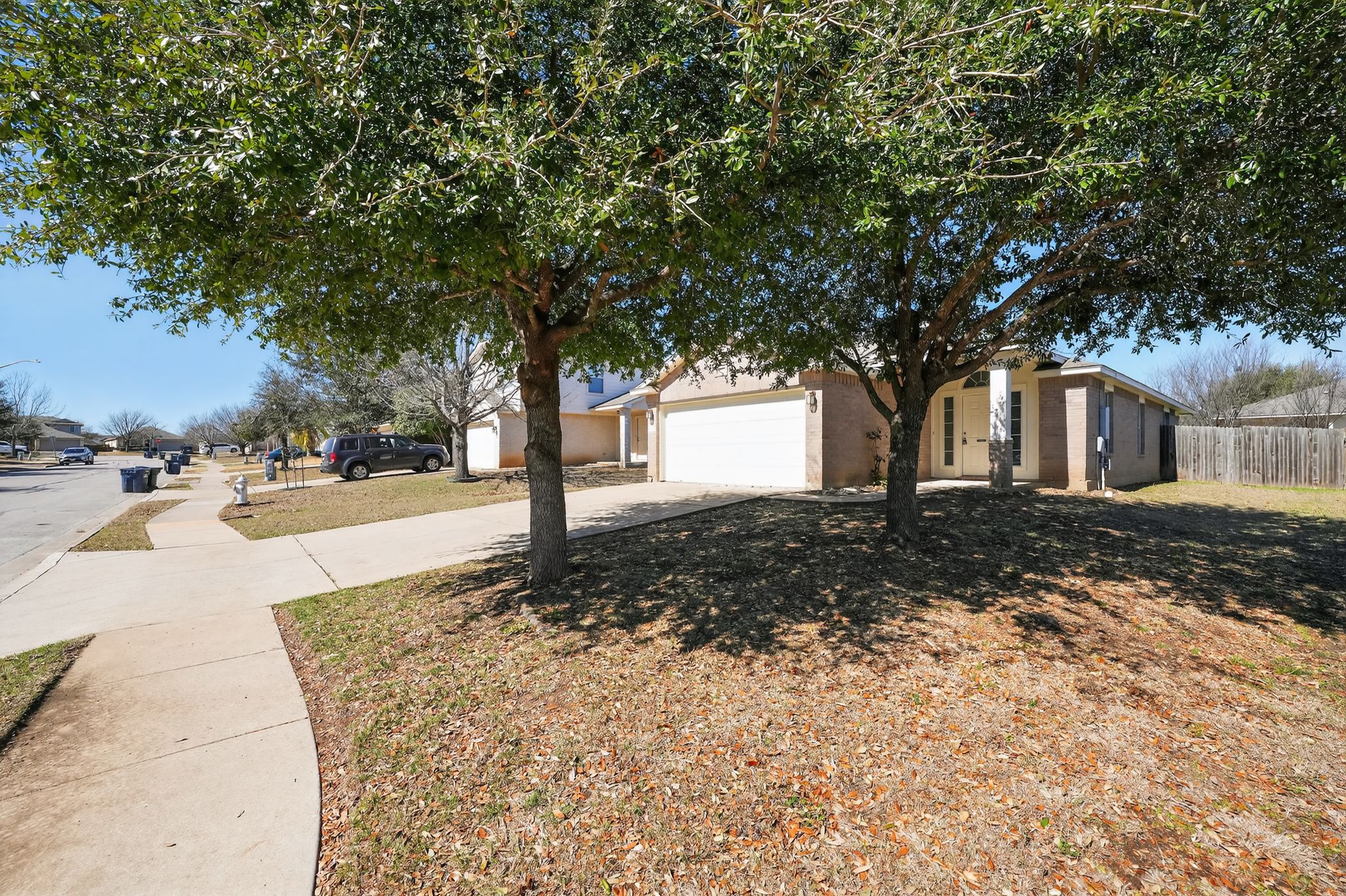 1007 Gentry Drive Leander, TX 78641 - Photo 5 of 35 a front view of a house with a yard